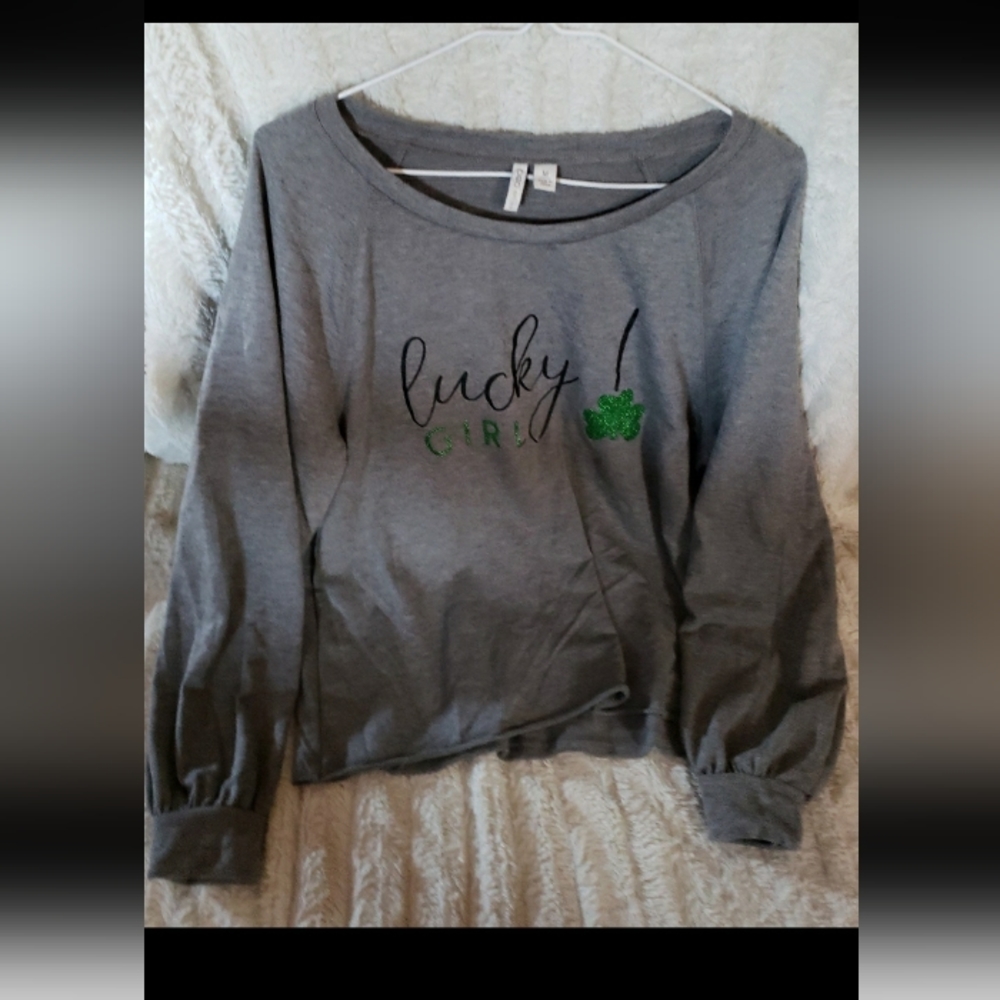 Cato top with shamrock on it